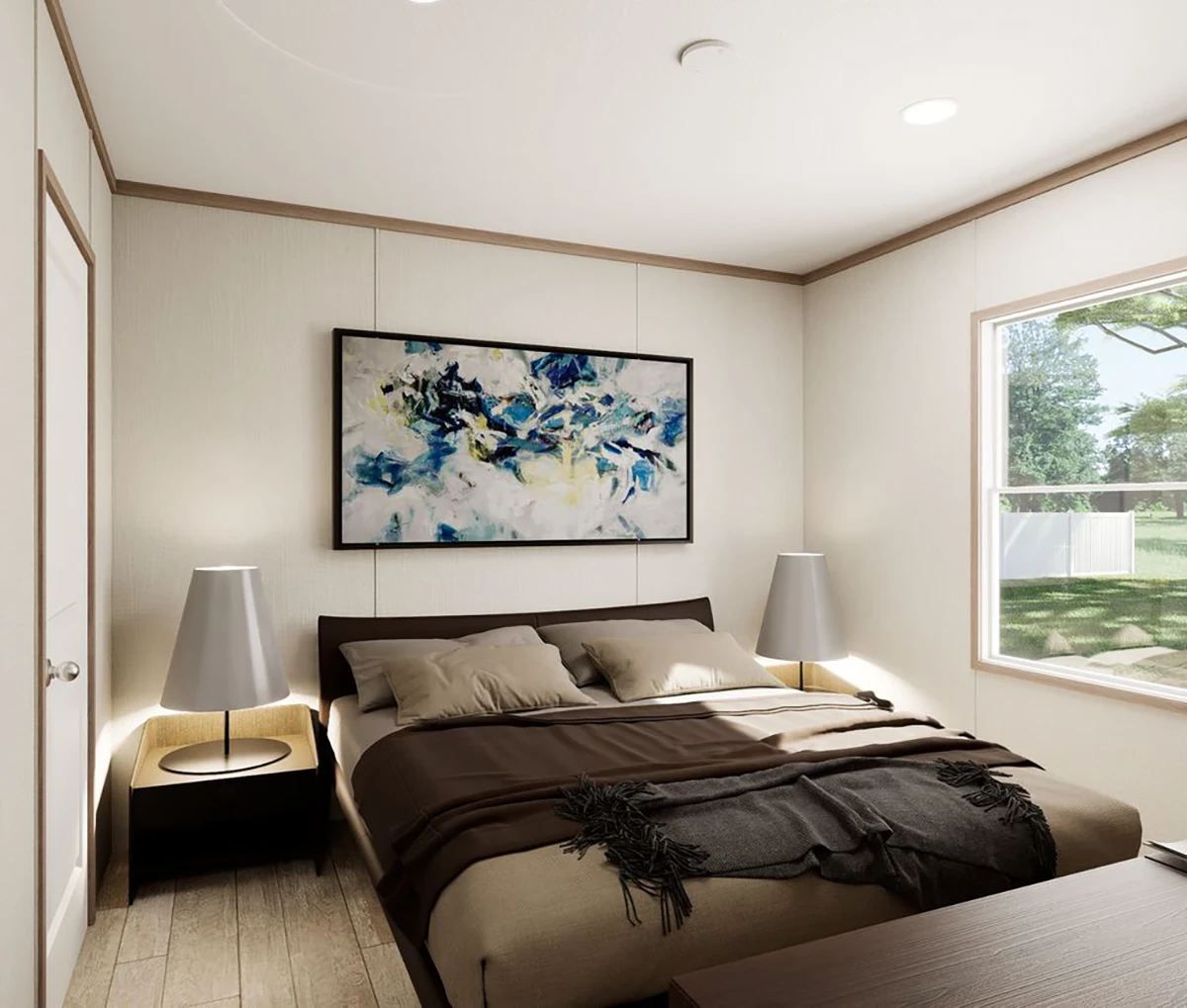 A bedroom with a double bed, brown bedding, two bedside tables with lamps, a large abstract painting above the bed, and a window with a view of a green yard.