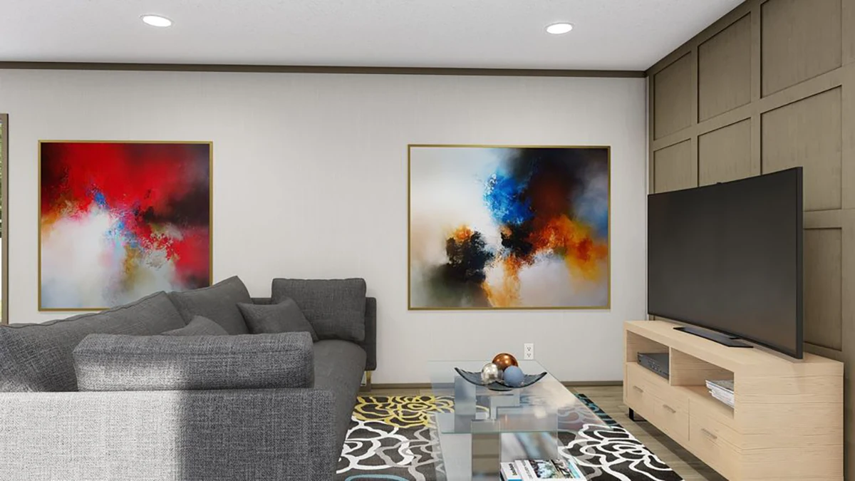 Modern living room with a gray sectional sofa, a glass coffee table, a large flat-screen TV on a wooden stand, and two abstract paintings on the wall.