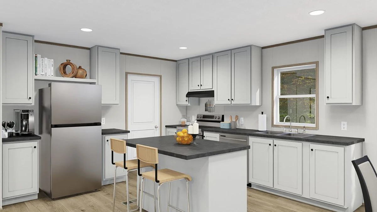 Modern kitchen with light gray cabinets, stainless steel appliances, a central island with two stools, and a bowl of oranges on the countertop. Window above the sink lets in natural light.