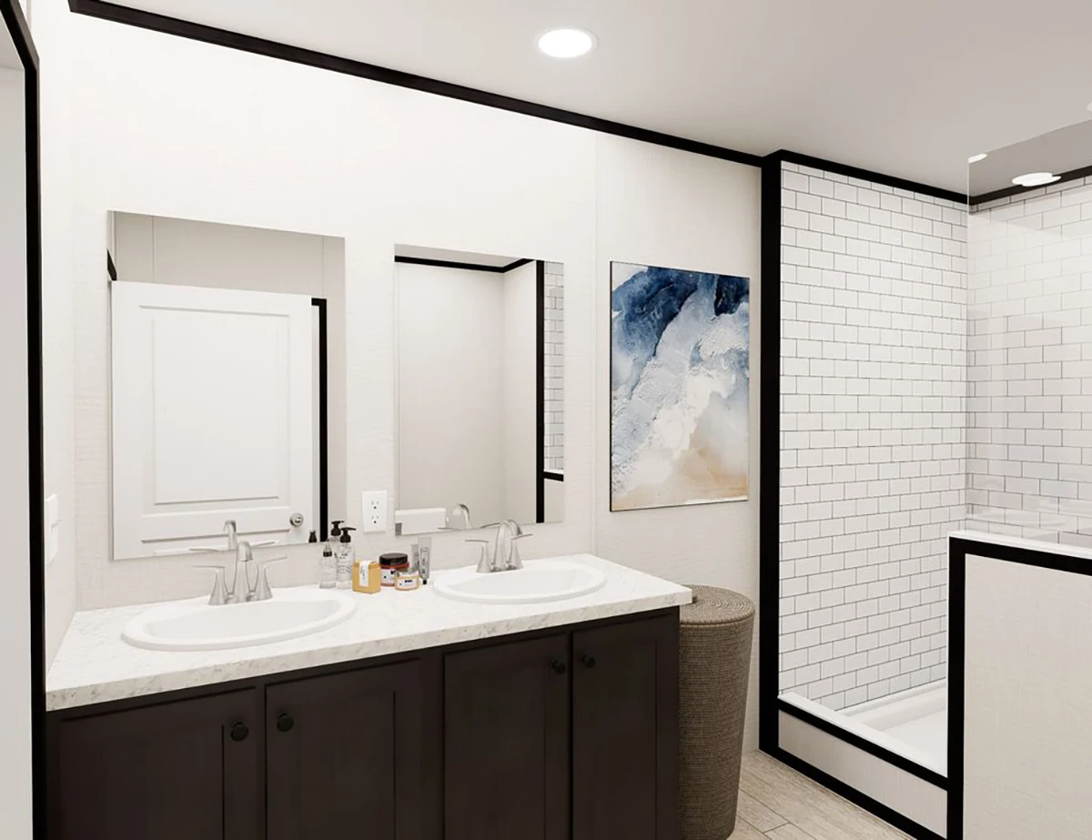 efbba356-230a-4f16-b0d8-dc3e5bc079e0 Modern bathroom with double sink vanity, marble countertop, wall mirror, abstract artwork, laundry hamper, and a glass-enclosed shower with white subway tiles.
