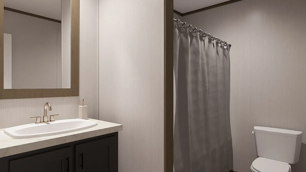 Modern bathroom with a single sink vanity, wall mirror, soap dispenser, toilet, and a shower with a gray curtain.