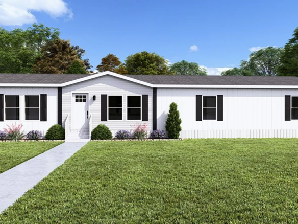 Single-story white manufactured home with black shutters, a central front door, shrubs along the foundation, and a concrete walkway, set on a grassy lawn with trees in the background.