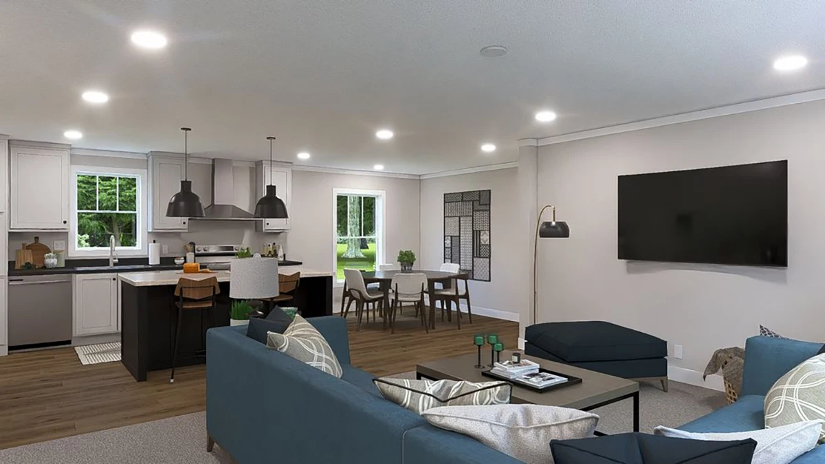 f55c482b-e8aa-41ef-b0e0-8e5ce5140699 Modern open-concept living area with a blue sofa, wall-mounted TV, kitchen island with stools, dining table, and large windows providing natural light.