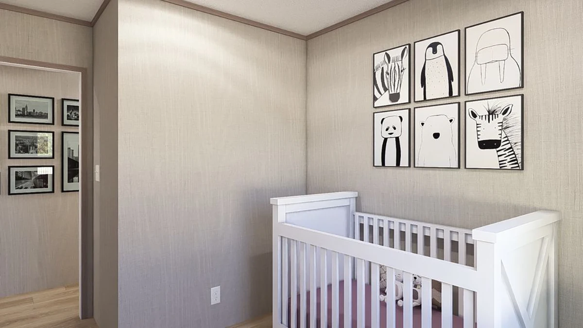 f79d04b4-8a58-4433-bf55-2896d8cd2192 A white crib is placed against a beige wall, with six black-and-white animal illustrations displayed above it in a grid. Framed photos are hung on the adjacent hallway wall.