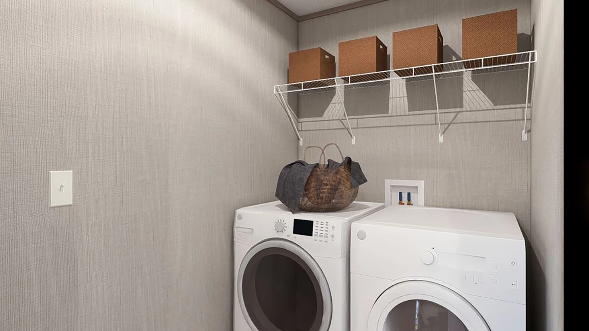 f9214492-6b89-4e92-bc74-5f98e7897317 A laundry room with a front-loading washer and dryer, baskets on top, and four brown storage bins on a wire shelf above.