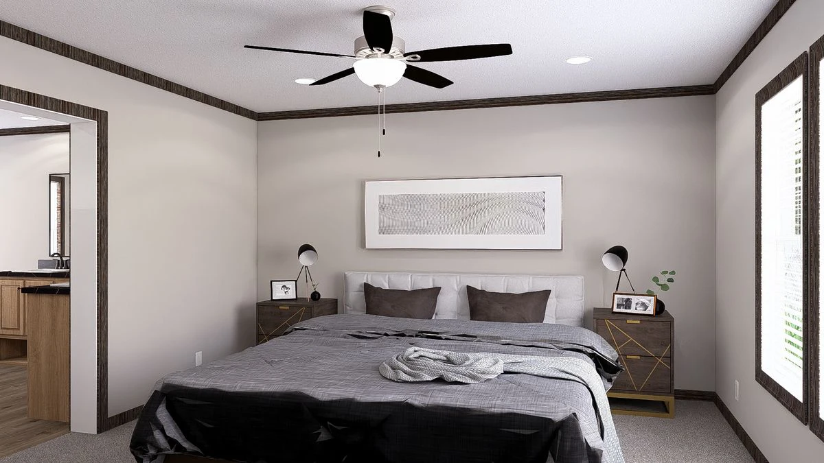 fa960cf1-3932-46dc-80ca-52b7b23dba22 A modern bedroom with a queen bed, gray bedding, two nightstands with lamps, framed art above the headboard, and a ceiling fan with light.