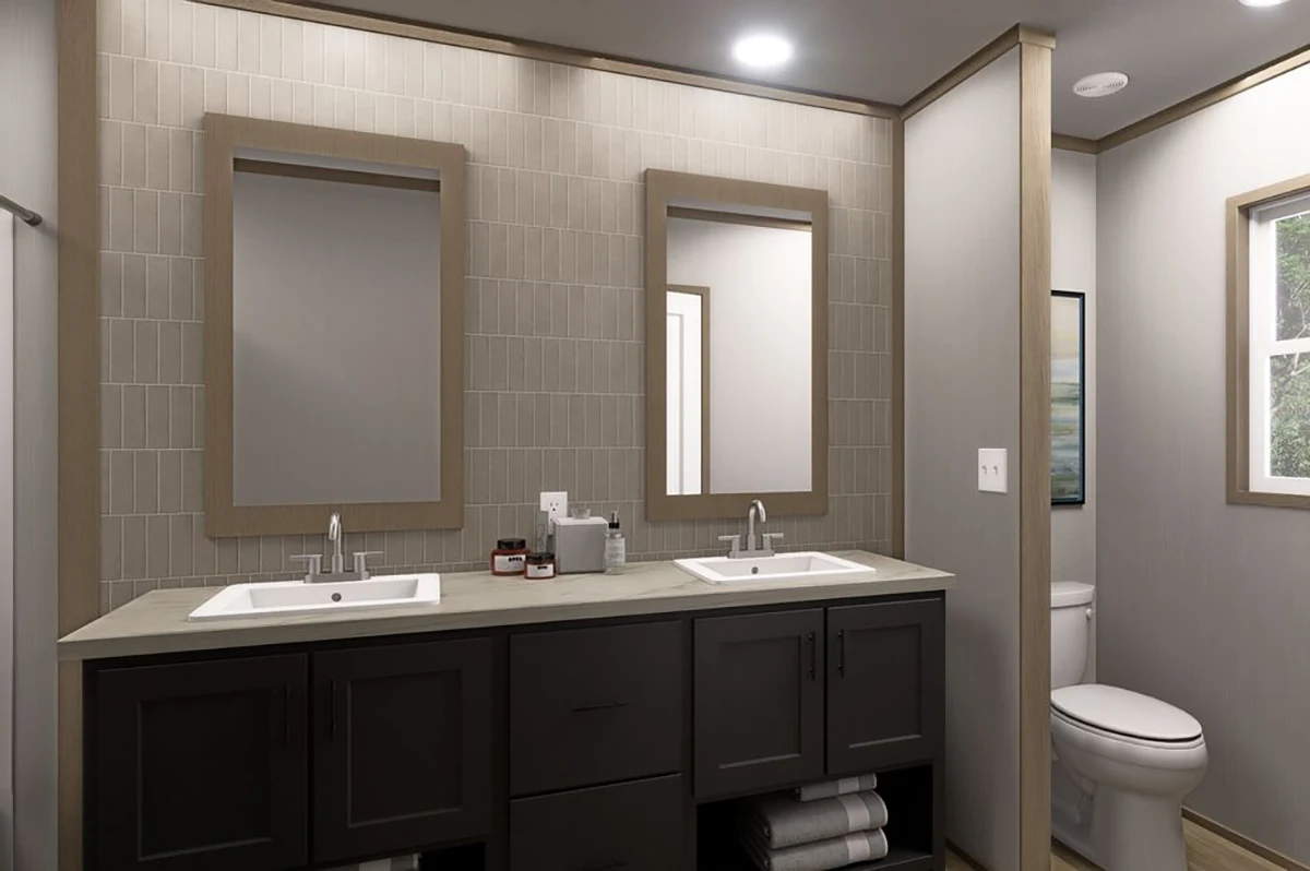 Modern bathroom with double sinks, two rectangular mirrors, dark cabinets, and a toilet near a window on the right side.