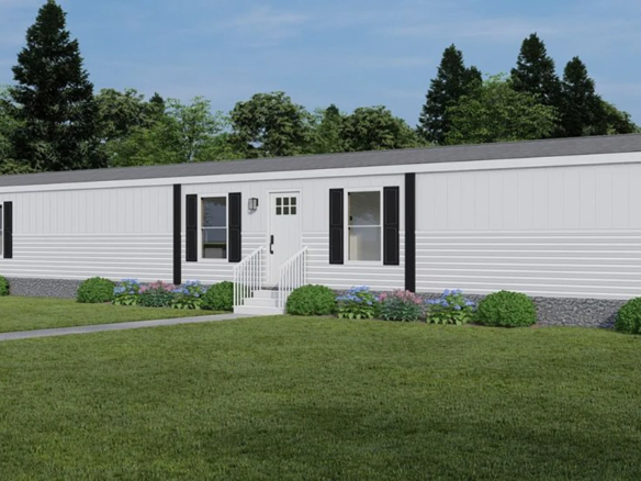 A white single-wide manufactured home with black shutters, a small stoop with steps, surrounded by a lawn, bushes, and trees in the background.