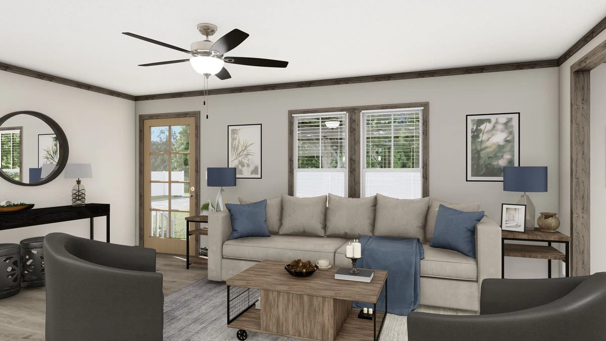 A modern living room features a beige sofa with blue cushions, two black armchairs, a wooden coffee table, lamps, wall art, and large windows letting in natural light.