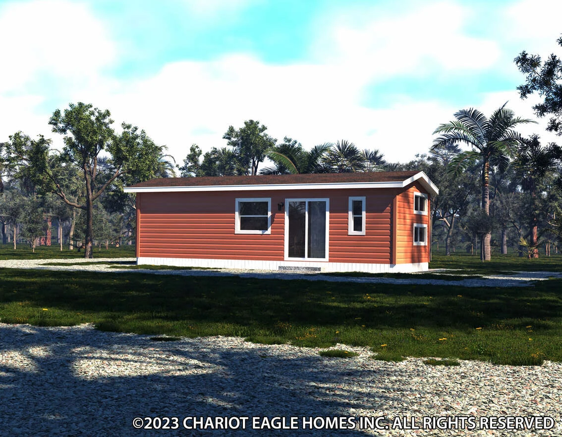 A small, single-story orange house with white trim sits on a grassy lot surrounded by trees under a partly cloudy sky.