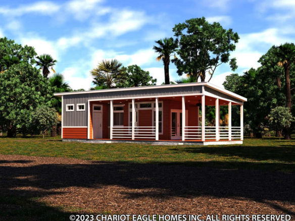 A modern single-story prefab home with a large covered porch, set in a grassy area with trees in the background.
