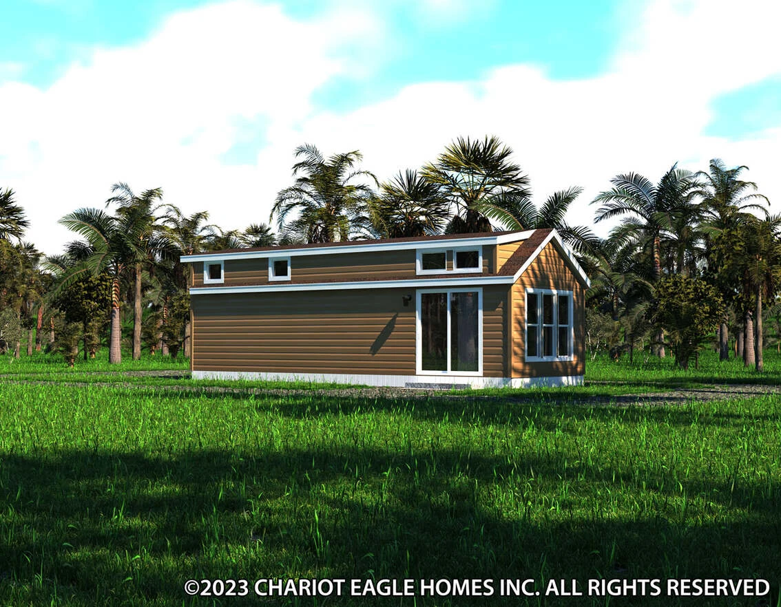A small brown house with white trim sits on a grassy field surrounded by palm trees under a partly cloudy sky.
