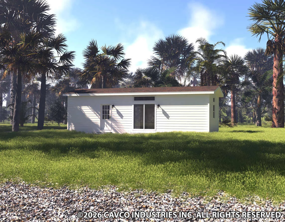 36hb13381g_rf0_1134_12 A small white modular home with a flat roof sits on a grassy lawn, surrounded by palm trees under a partly cloudy sky.