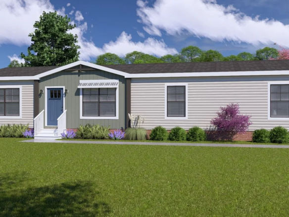 Single-story manufactured home with beige siding, blue front door, steps leading to entrance, and minimal landscaping on a grassy lawn under a partly cloudy sky.