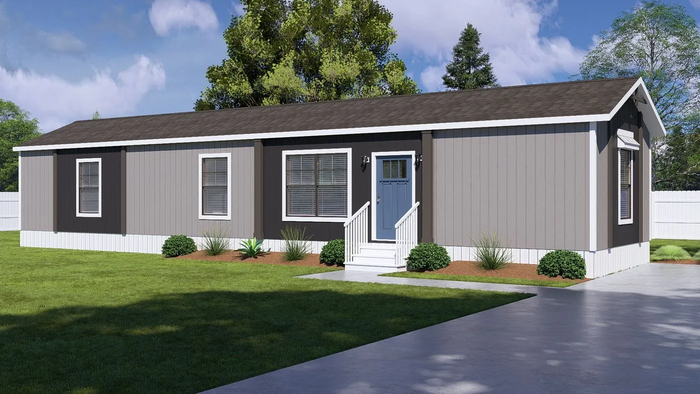 A single-story, gray manufactured home with white trim, a small front porch, and steps, surrounded by a green lawn and shrubs, with trees and a driveway nearby.