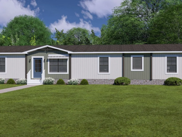 Single-story manufactured home with gray siding, white trim, dark roof, front door with small steps, several windows, and a green lawn with shrubs and trees in the background.